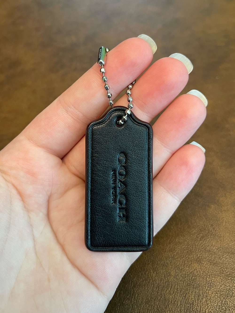 Coach hang tag